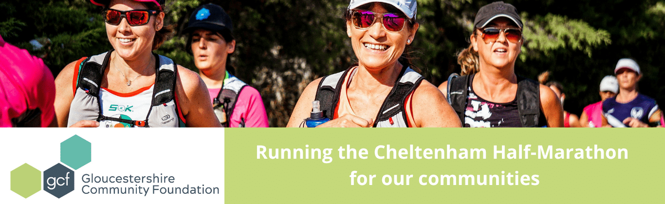 The image is an picture of a group of runners, participating in a half-marathon through a scenic, tree-lined path. The runners are wearing numbered bibs and athletic gear, and evokes a vibrant, energetic, and community-focused atmosphere. The image promotes the participation of GCF in the Cheltenham (Chelt) Half-Marathon as a fundraising or community engagement effort.