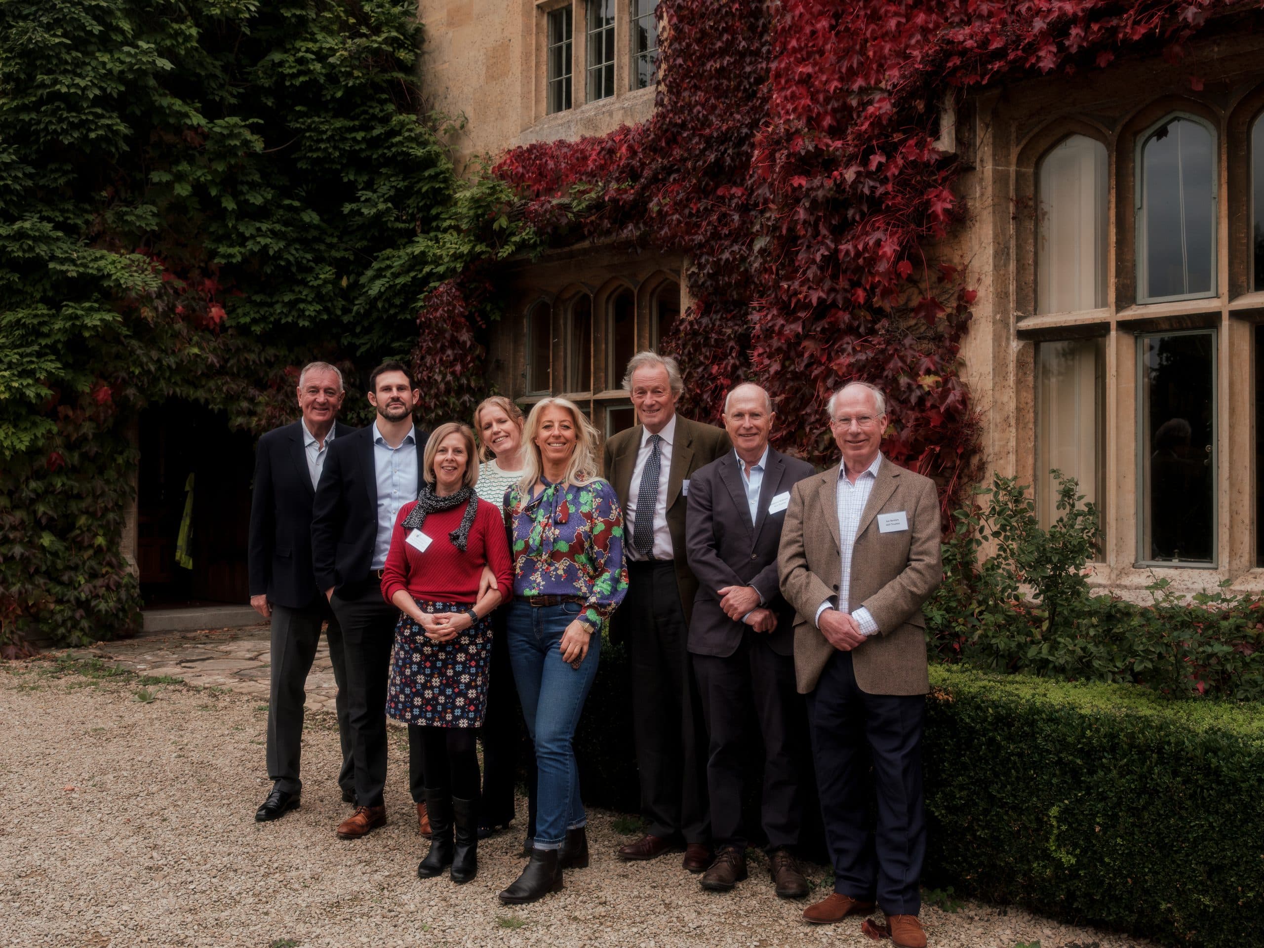 A group picture of the GCF team standing outside the Manor at Boddington