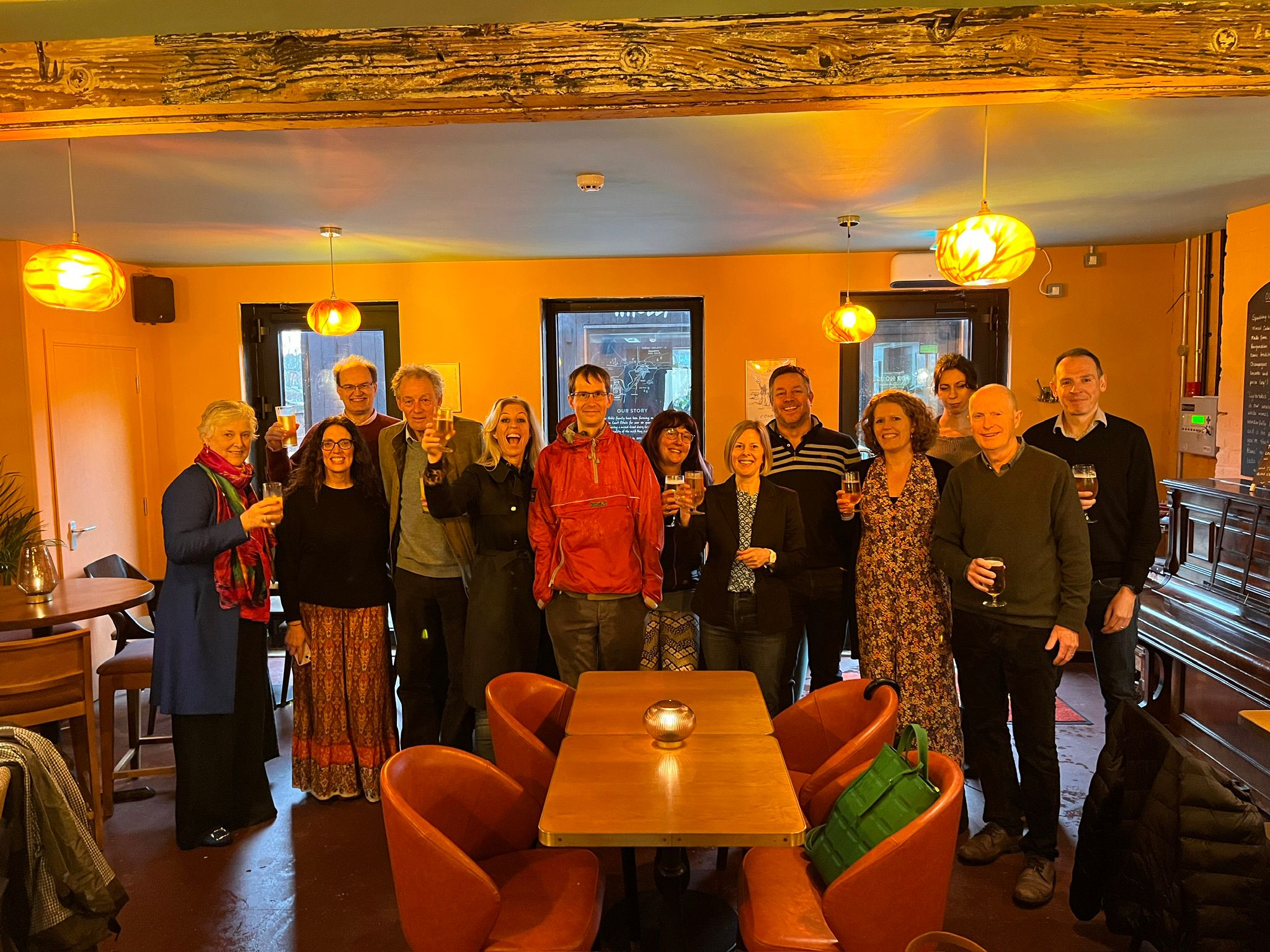 The GCF team and board celebrating the good news about receiving an A grade from the FPR rating